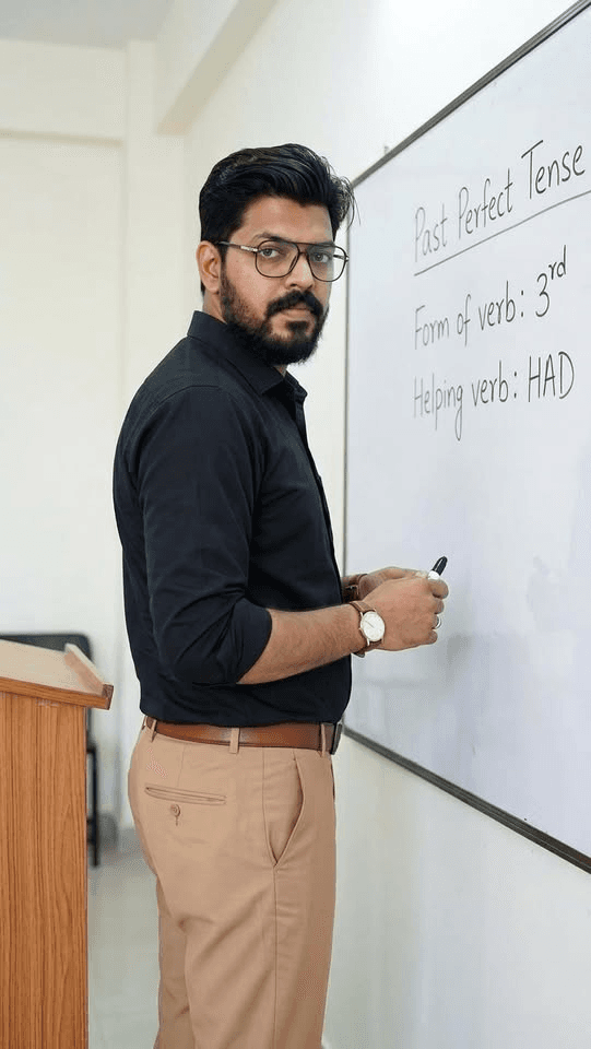 Sir Arslan Ilyas teaching at the whiteboard